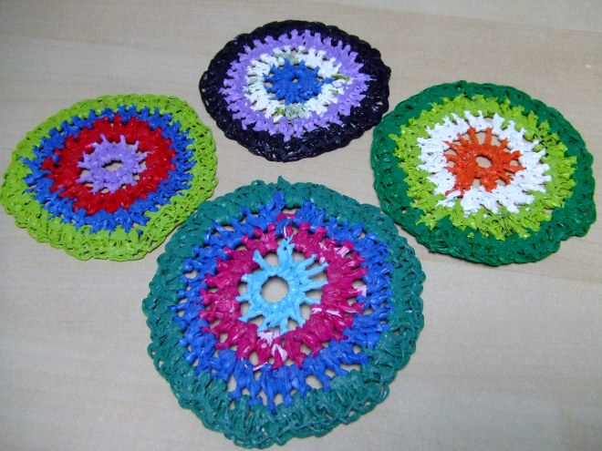 Four crocheted coasters